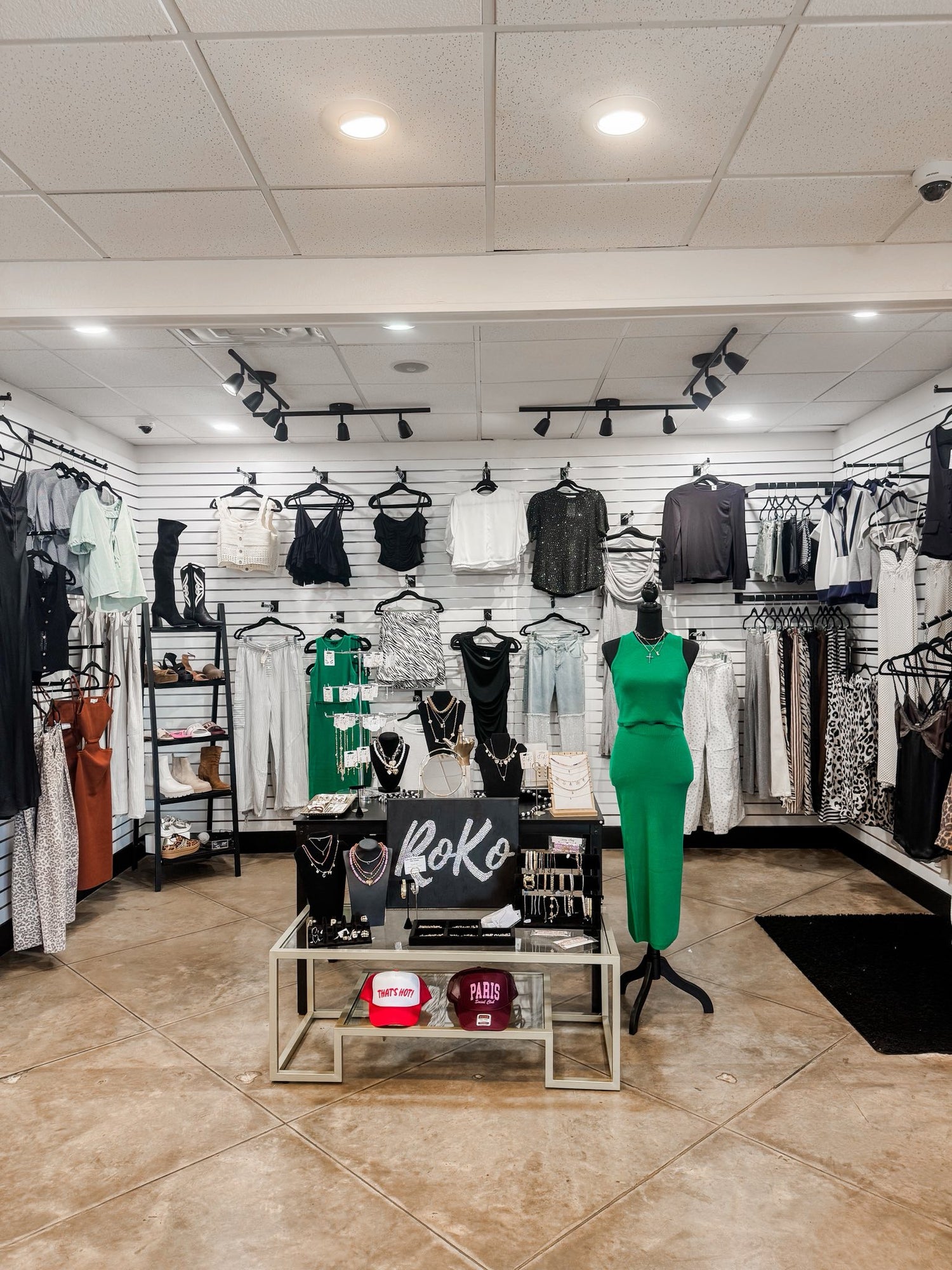 Display of jewelry and formal clothes, set up at RoKo Boutique.