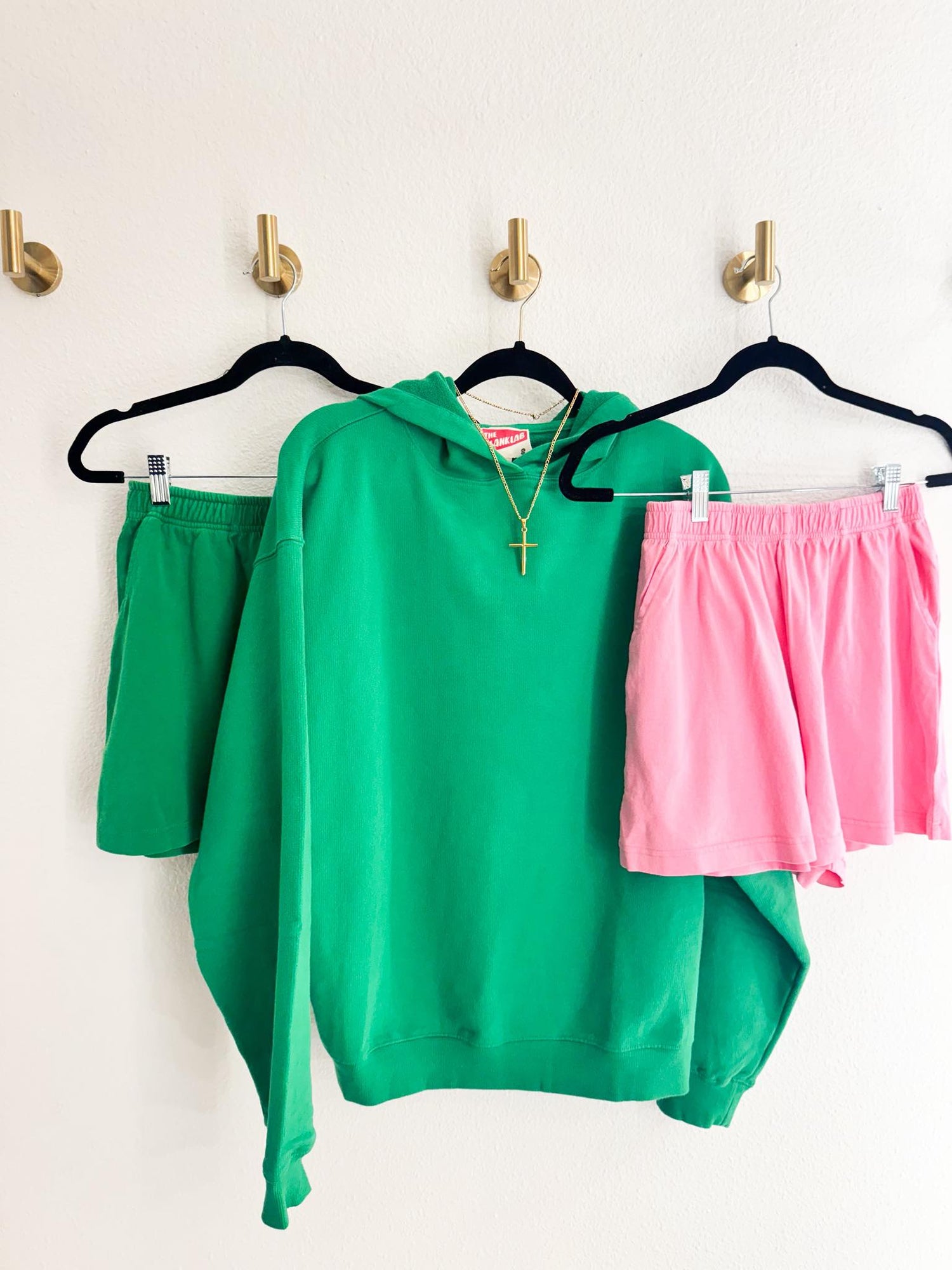 Green hoodie from RoKo Boutique with matching green or pink shorts to complete the set.