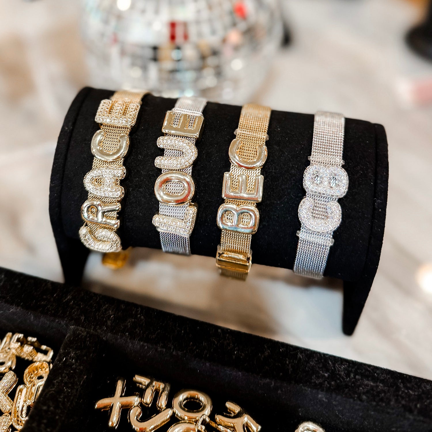 Custom initial and nameplate boutique jewelry from RoKo — personalized necklaces and bracelets.